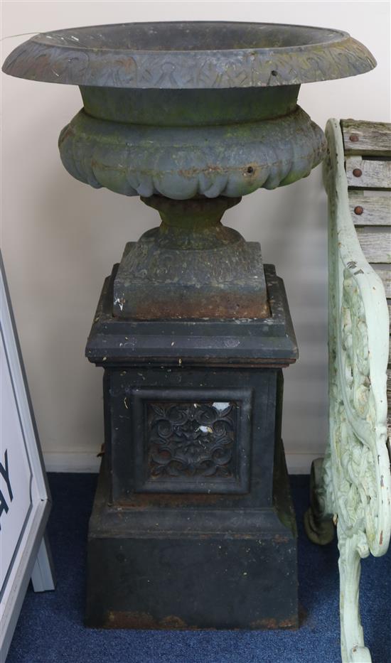 A pair of Victorian cast iron garden urns and pedestals, H.95cm